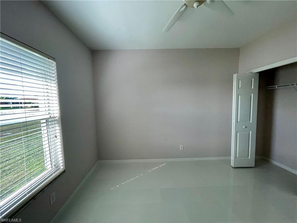 2895 Orange Grove Trail Naples, FL 34120 - Photo 14 of 33 an empty room with windows