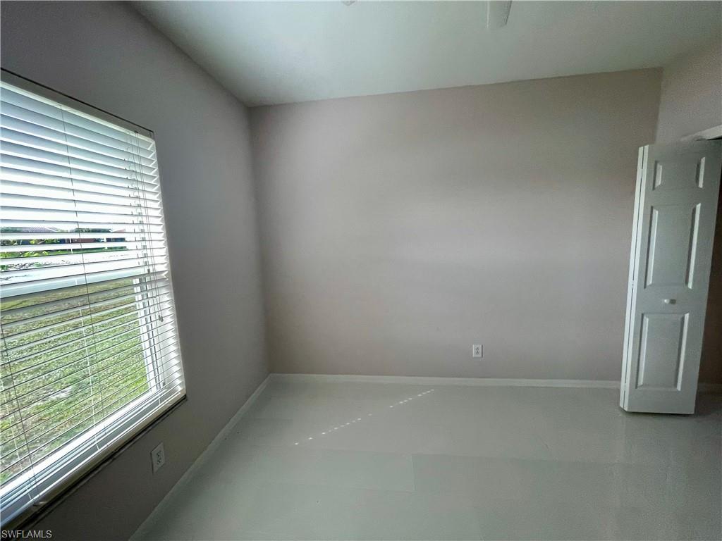 2895 Orange Grove Trail Naples, FL 34120 - Photo 15 of 33 a view of an empty room with a window