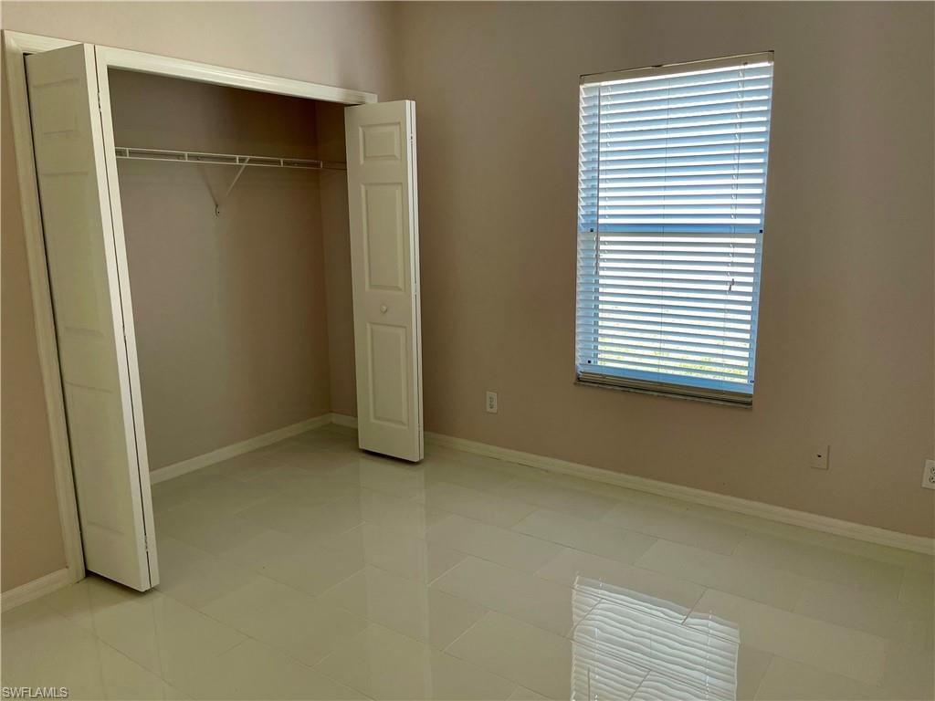 2895 Orange Grove Trail Naples, FL 34120 - Photo 17 of 33 an empty room with a window