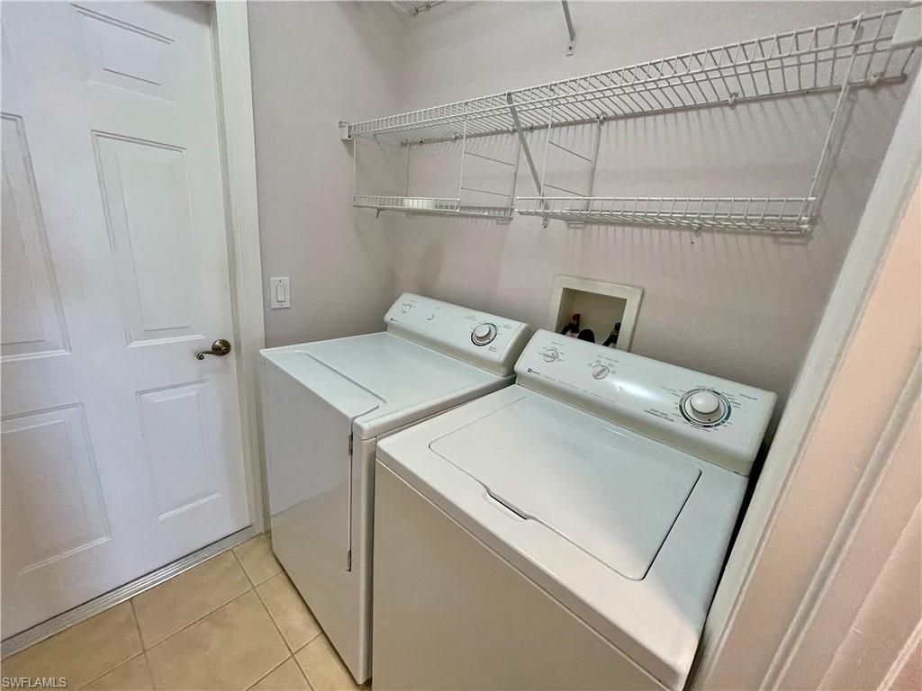2895 Orange Grove Trail Naples, FL 34120 - Photo 20 of 33 a utility room with dryer and washer