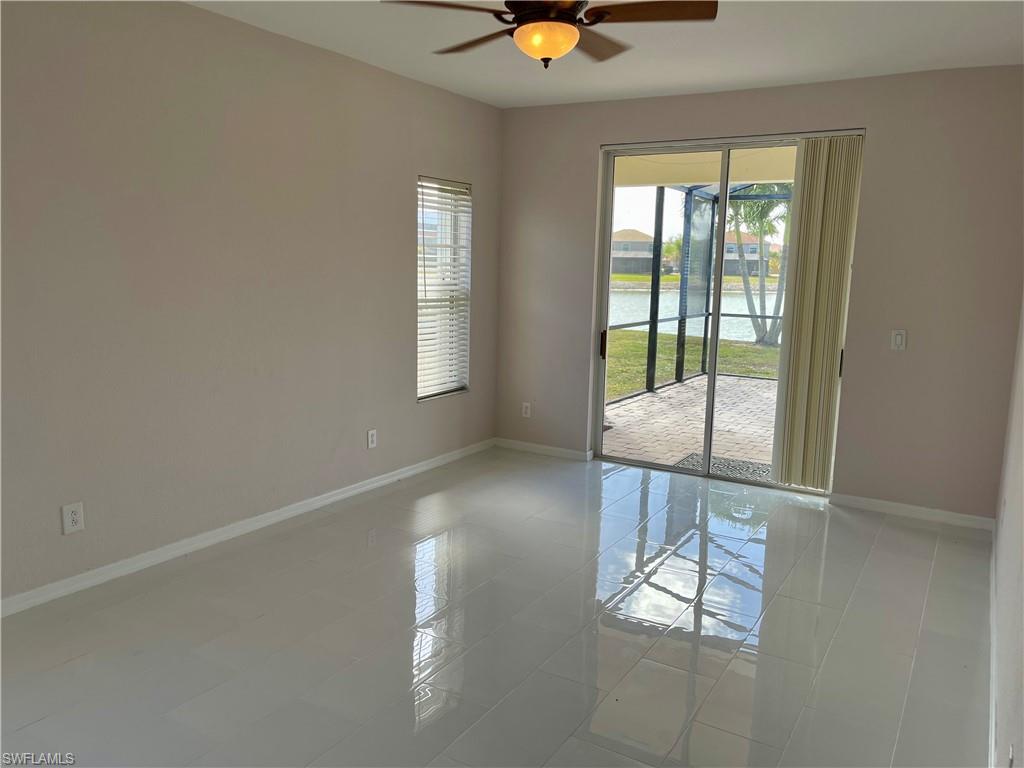 2895 Orange Grove Trail Naples, FL 34120 - Photo 21 of 33 an empty room with windows