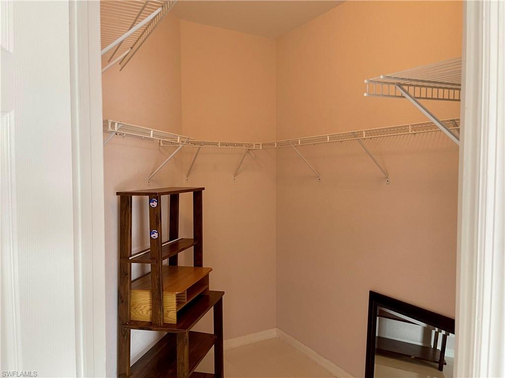 2895 Orange Grove Trail Naples, FL 34120 - Photo 22 of 33 a view of a room with rack on the wall