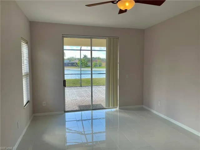 a kitchen with stainless steel appliances granite countertop a sink refrigerator and microwave