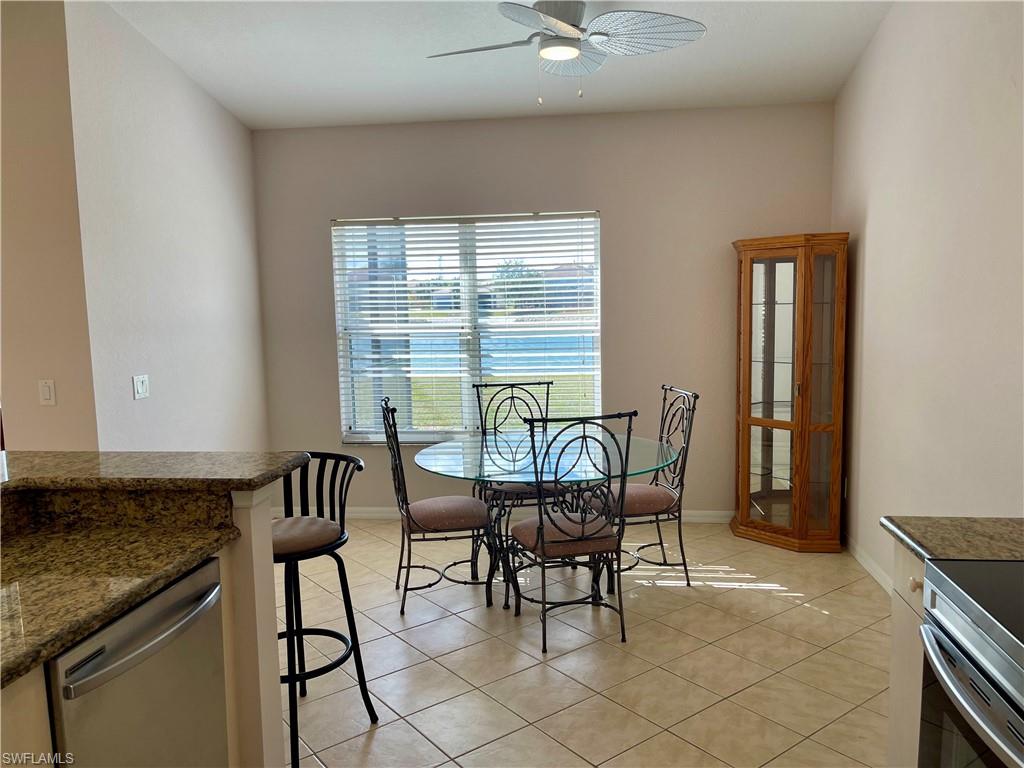 2895 Orange Grove Trail Naples, FL 34120 - Photo 29 of 33 a dining room with furniture and window