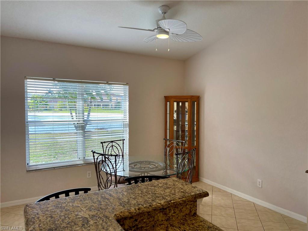 2895 Orange Grove Trail Naples, FL 34120 - Photo 31 of 33 a bedroom with furniture and a window