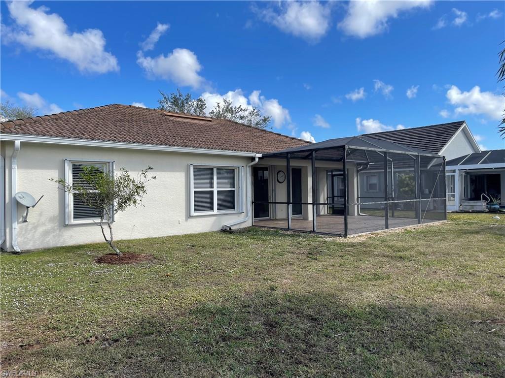 2895 Orange Grove Trail Naples, FL 34120 - Photo 33 of 33 a house with lots of trees in the background