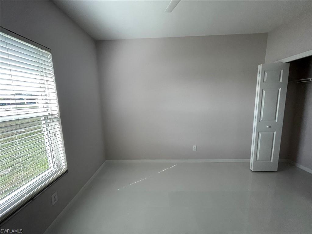 2895 Orange Grove Trail Naples, FL 34120 - Photo 4 of 33 an empty room with a window