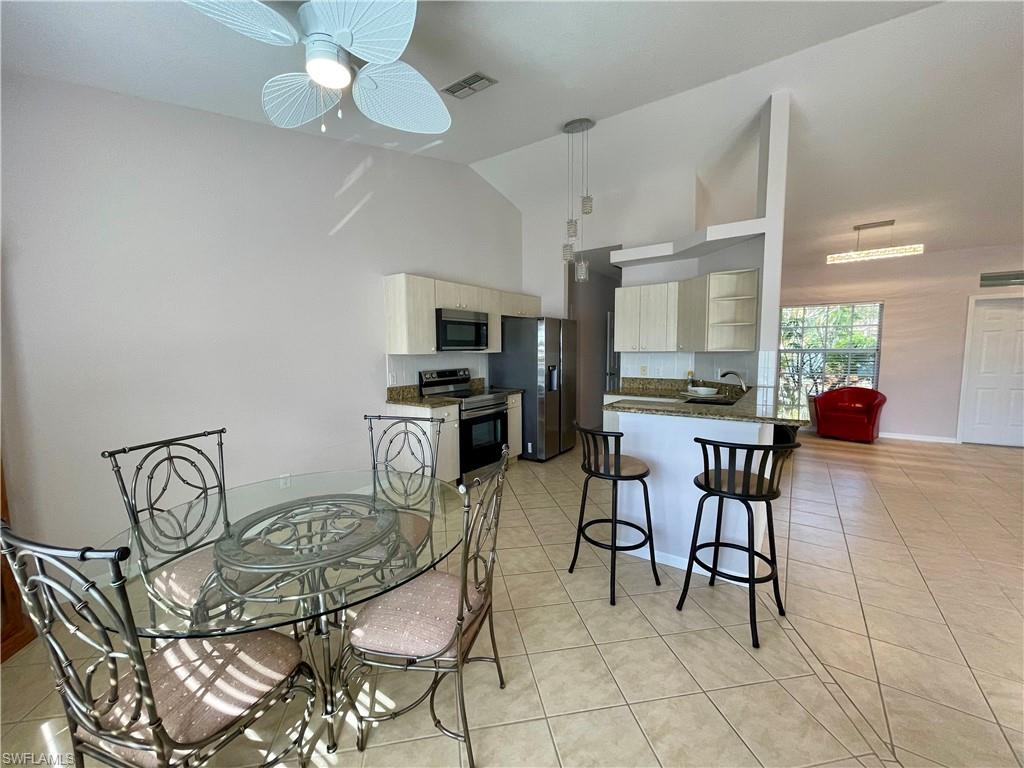 2895 Orange Grove Trail Naples, FL 34120 - Photo 8 of 33 a view of a dining room with furniture