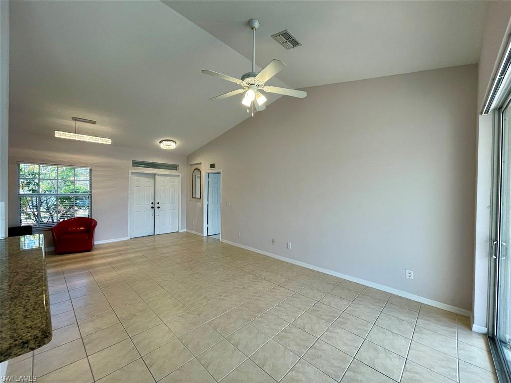 2895 Orange Grove Trail Naples, FL 34120 - Photo 9 of 33 an empty room with windows and fan