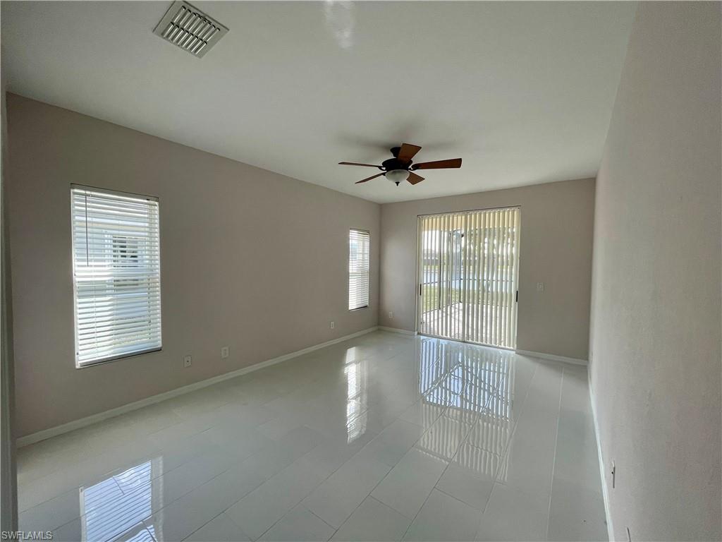 2895 Orange Grove Trail Naples, FL 34120 - Photo 10 of 33 a view of an empty room with a window