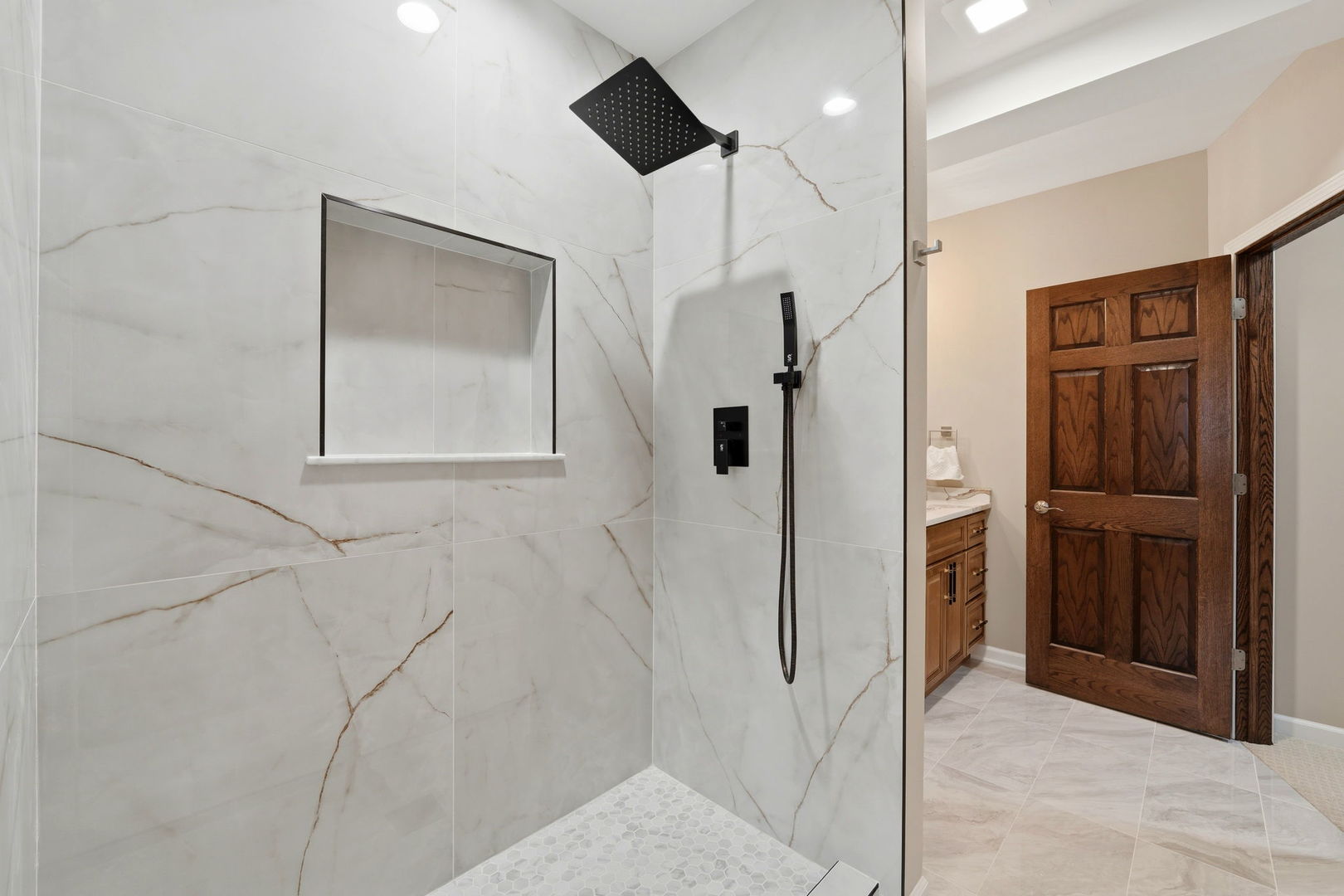 1406 Rue Paris Place Inverness, IL 60067 - Photo 28 of 35 a bathroom with a mirror and a shower