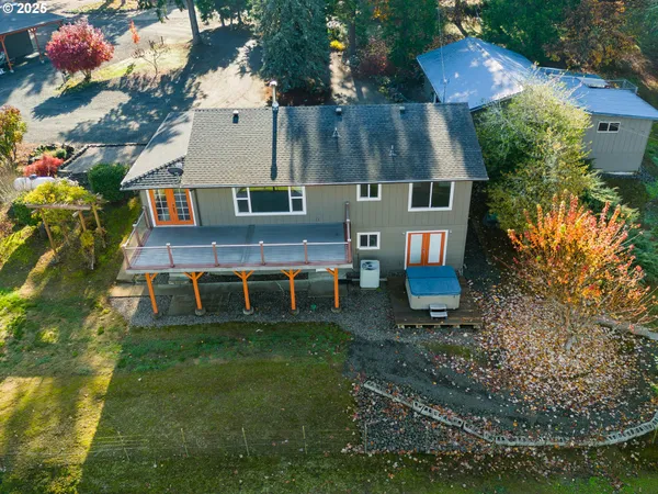 an aerial view of a house with a yard
