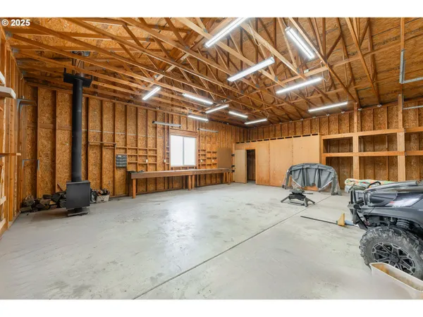 a room with gym equipment and natural light