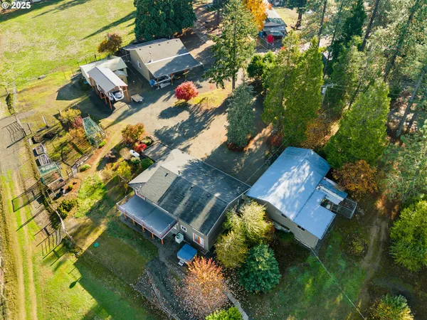 an aerial view of residential house with outdoor space and swimming pool
