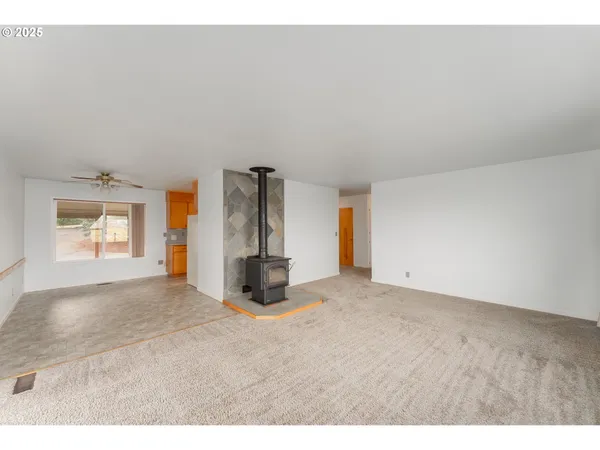 a view of empty room with windows