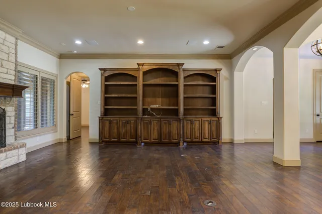 a kitchen with stainless steel appliances granite countertop a refrigerator and cabinets