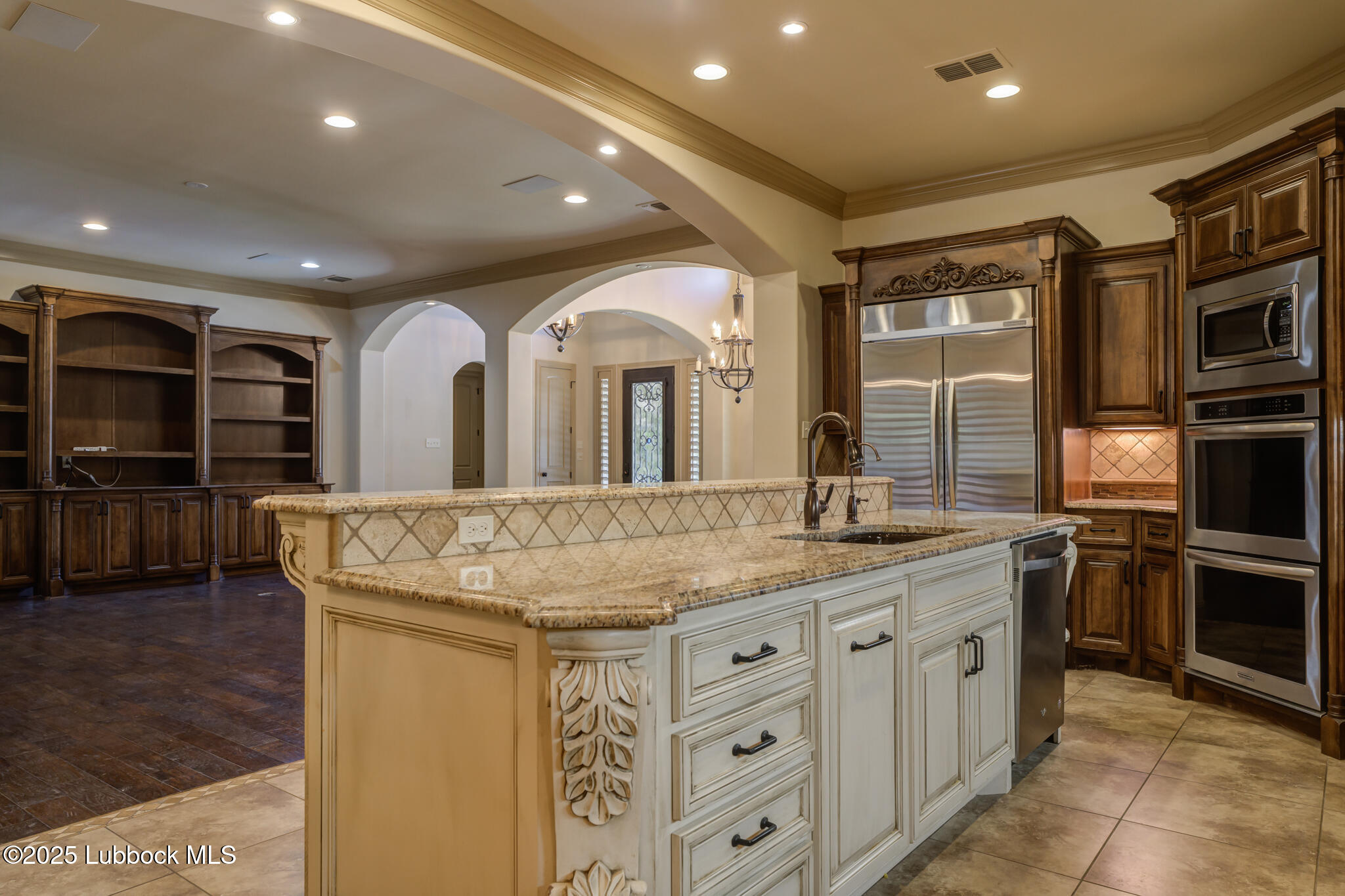 6103 89th Street Lubbock, TX 79424 - Photo 32 of 73 a spacious bathroom with a granite countertop sink and a large mirror