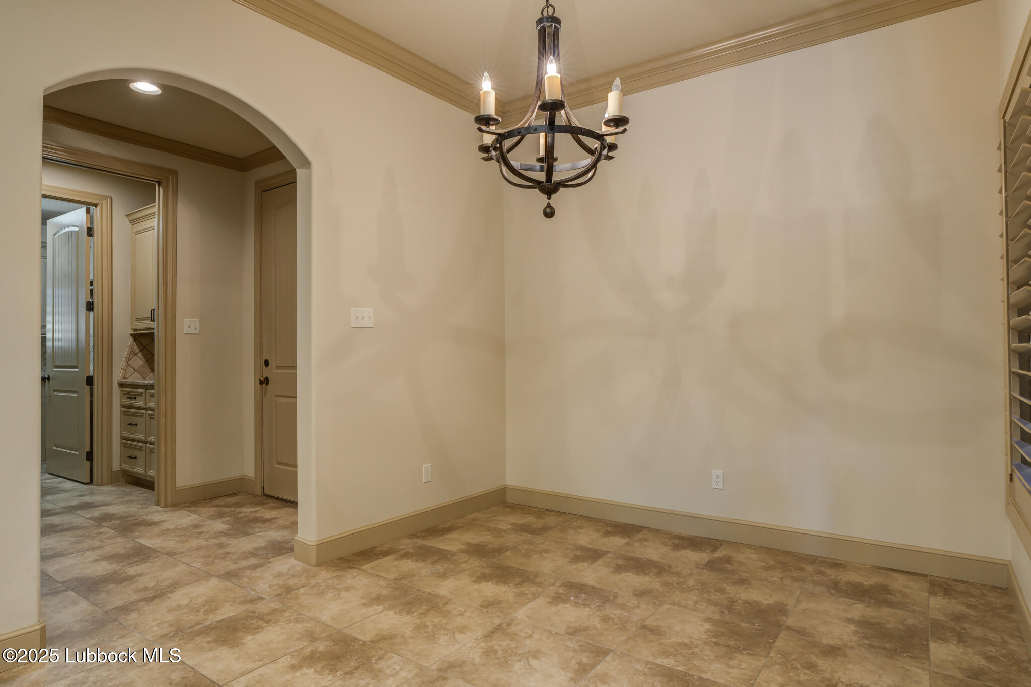 6103 89th Street Lubbock, TX 79424 - Photo 37 of 73 a view of empty room with chandelier fan and refrigerator