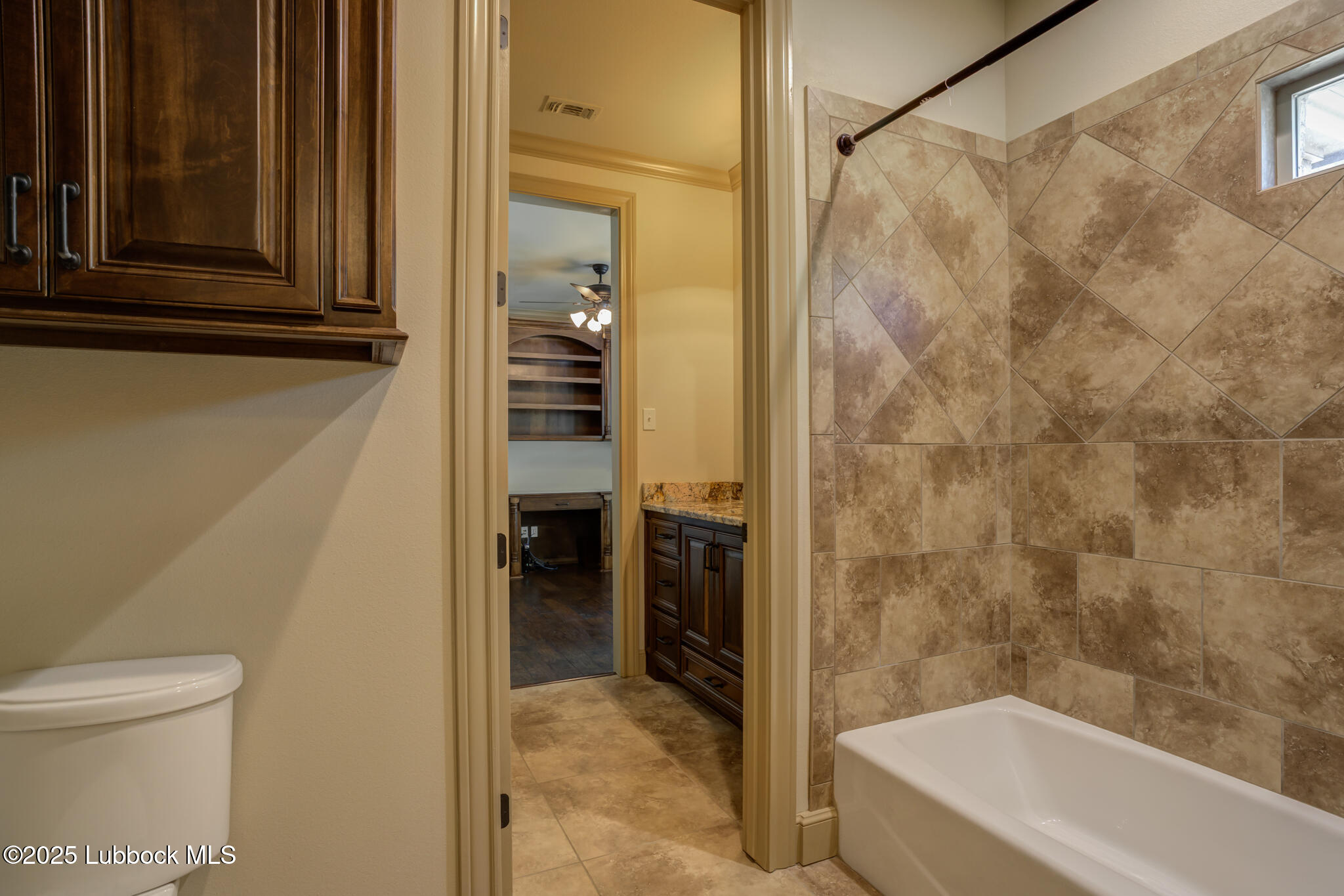 6103 89th Street Lubbock, TX 79424 - Photo 46 of 73 a bathroom with a bathtub and a shower
