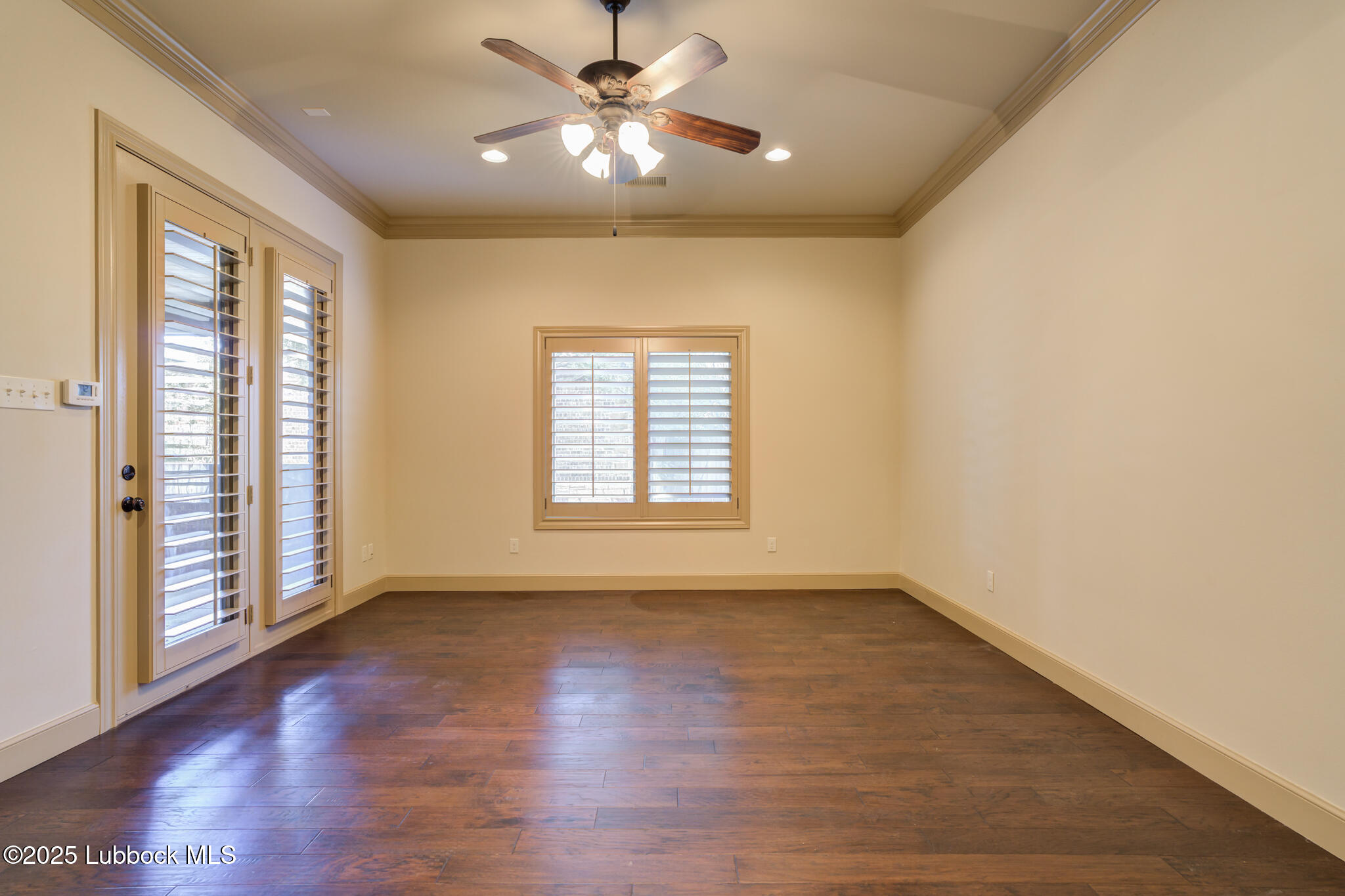 6103 89th Street Lubbock, TX 79424 - Photo 60 of 73 wooden floor in an empty room with a window