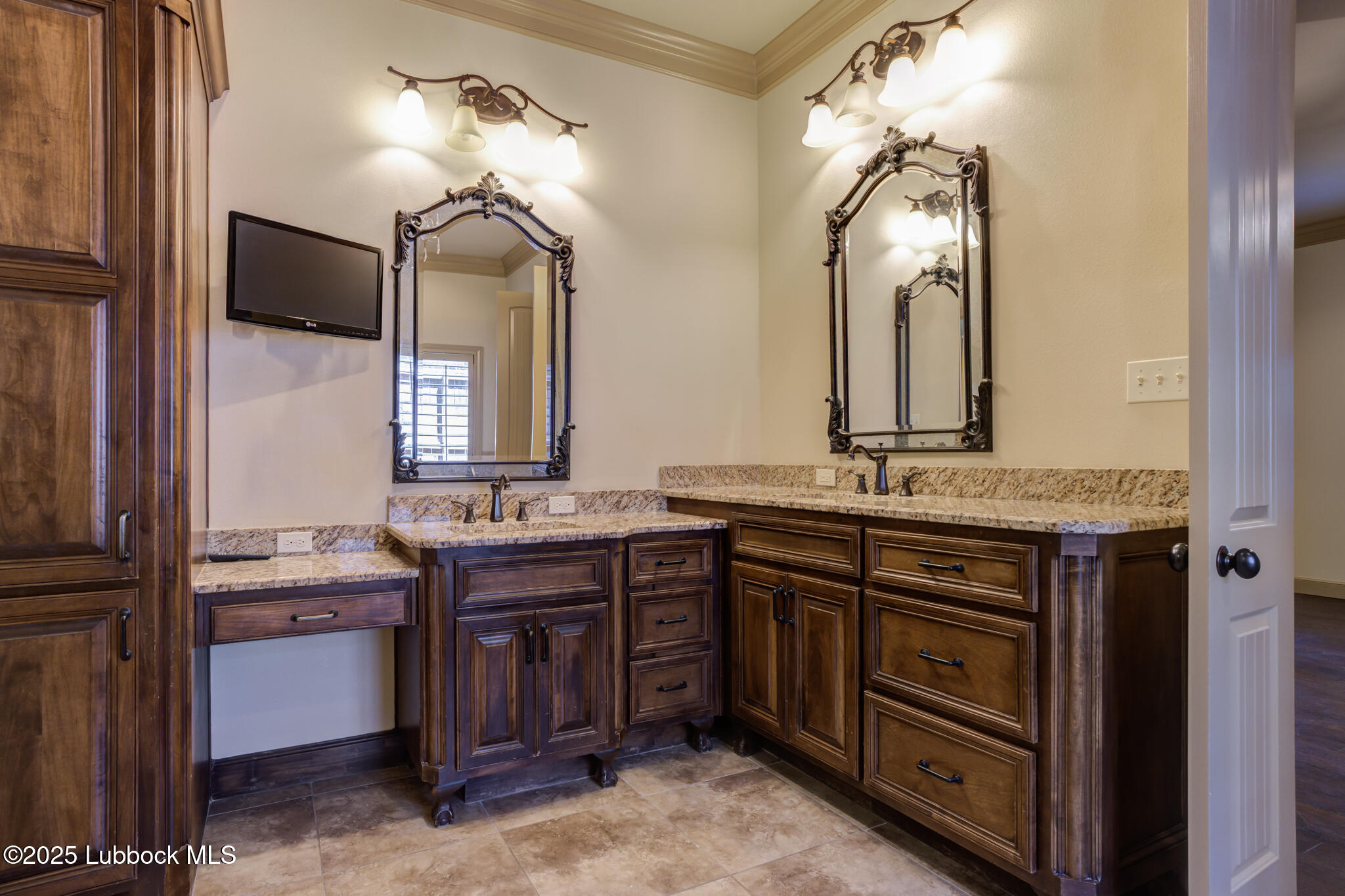 6103 89th Street Lubbock, TX 79424 - Photo 64 of 73 a bathroom with a granite countertop sink and a mirror