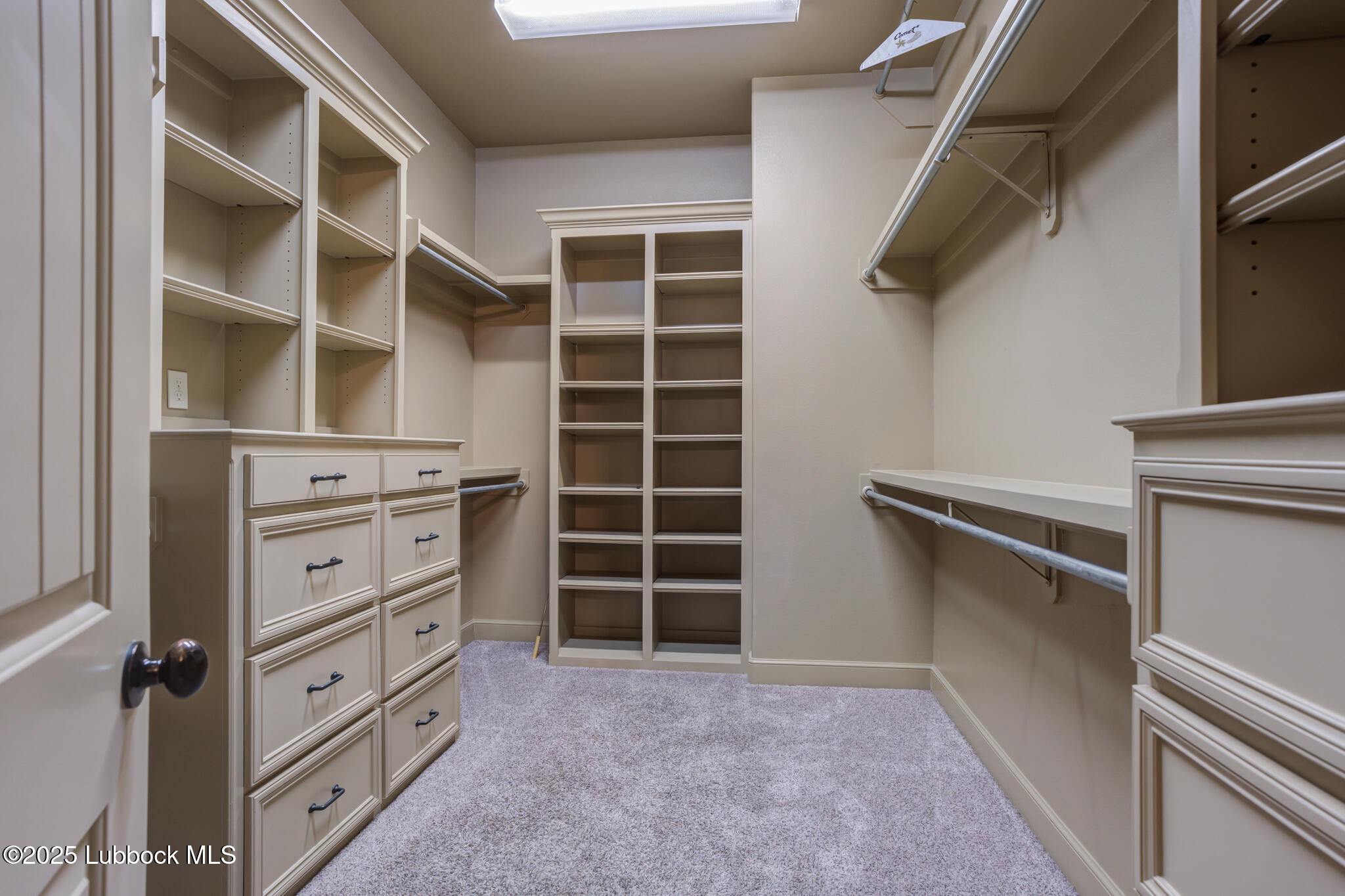 6103 89th Street Lubbock, TX 79424 - Photo 65 of 73 a view of an empty walk in closet