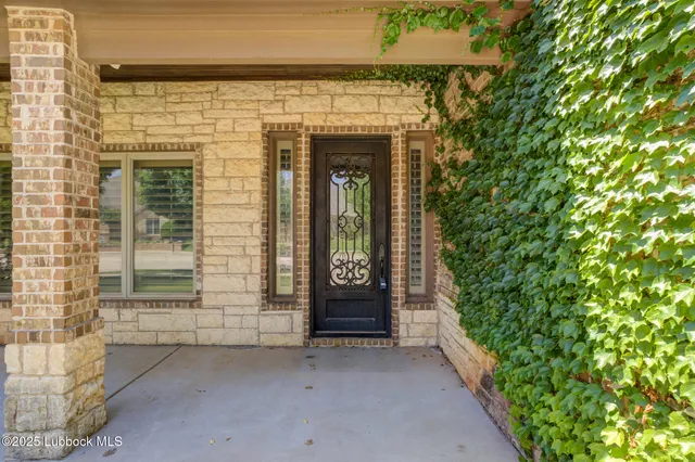 a view of a livingroom with wooden floor and a window