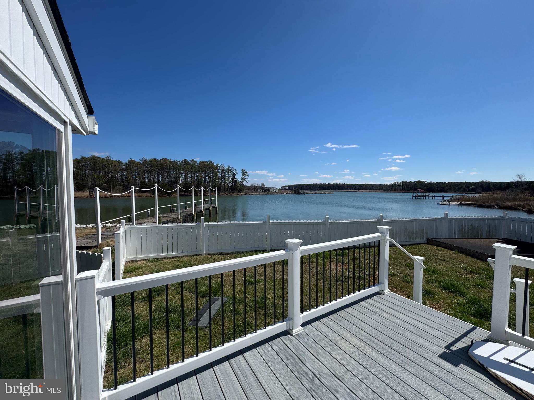 5511 Cassons Neck Road Cambridge, MD 21613 - Photo 12 of 20 a view of balcony with furniture and a garden