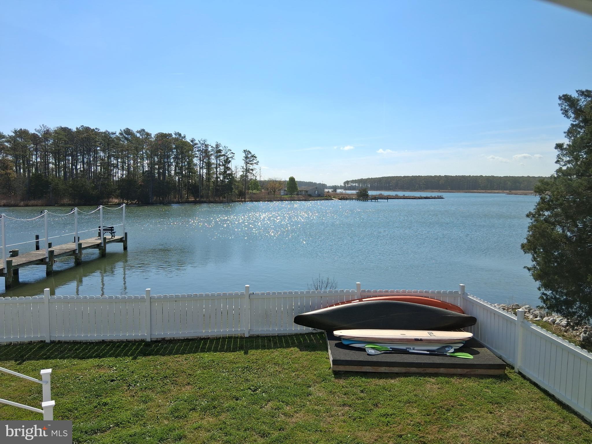 5511 Cassons Neck Road Cambridge, MD 21613 - Photo 24 of 24 a view of a lake with houses in back