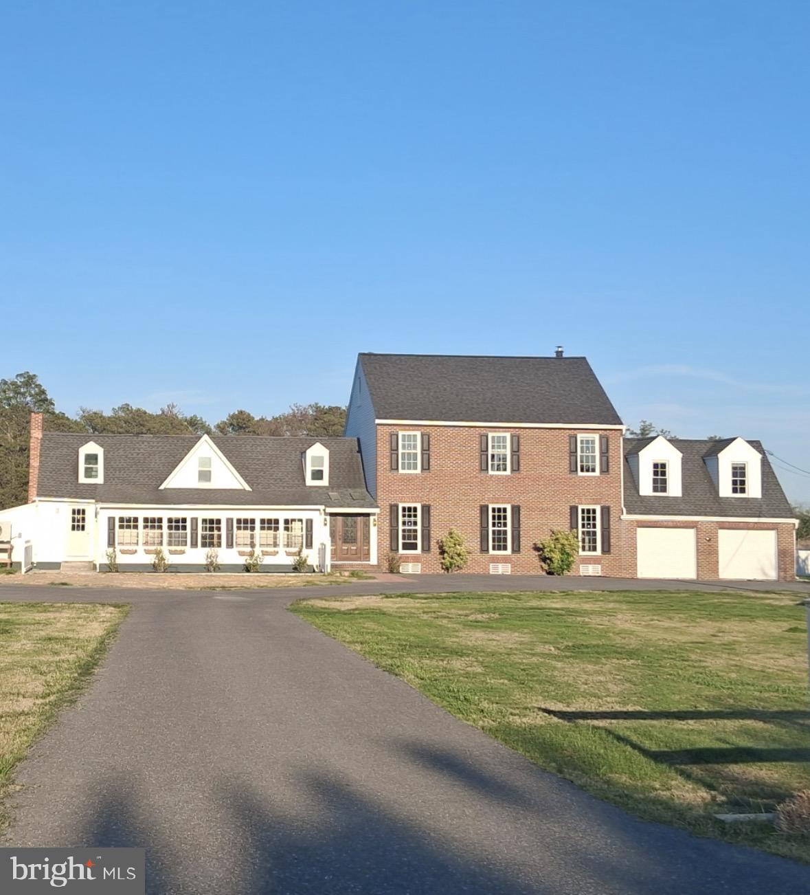 5511 Cassons Neck Road Cambridge, MD 21613 - Photo 3 of 24 a front view of a house with a yard