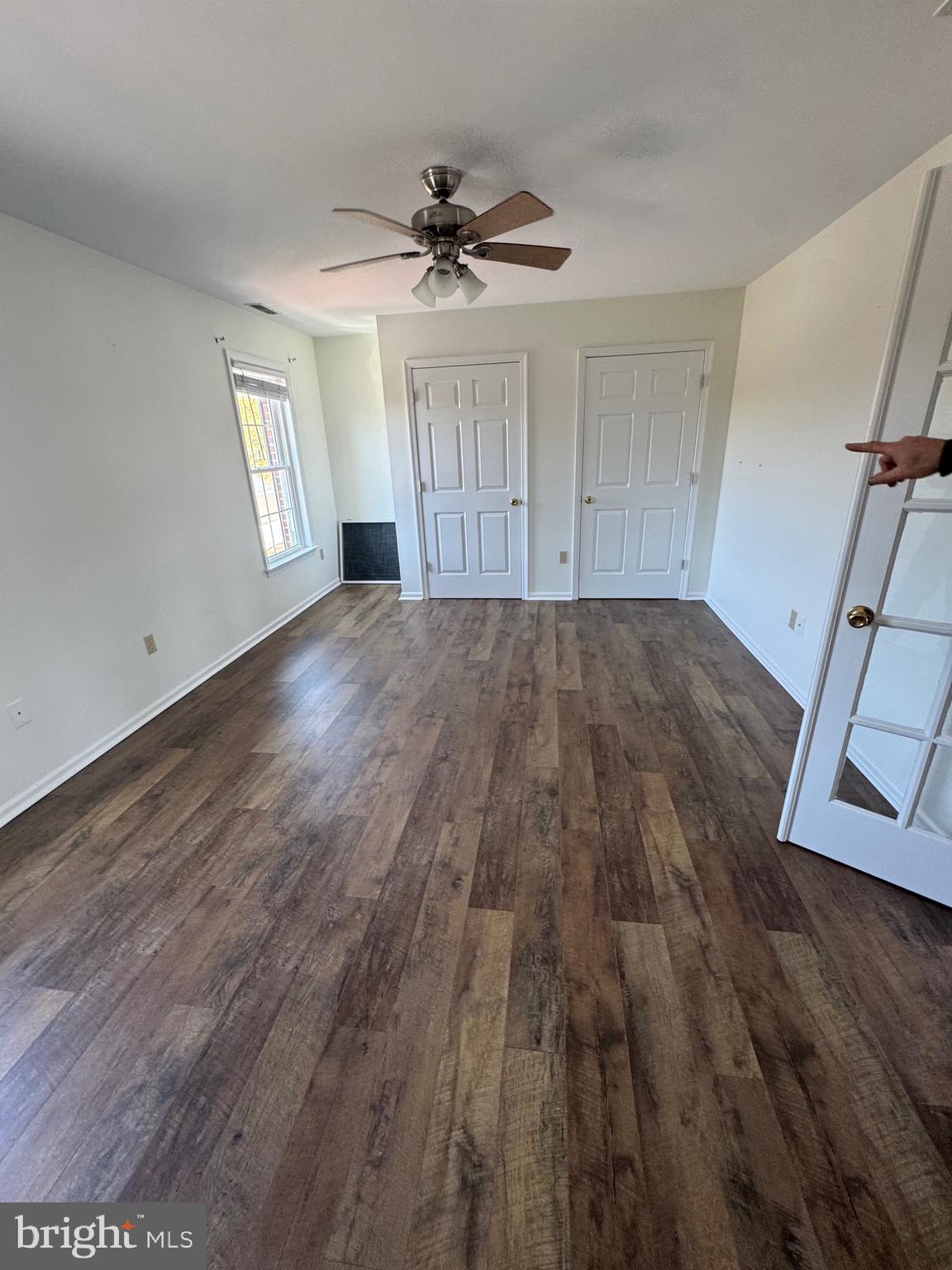 5511 Cassons Neck Road Cambridge, MD 21613 - Photo 5 of 24 a view of empty room with wooden floor and fan