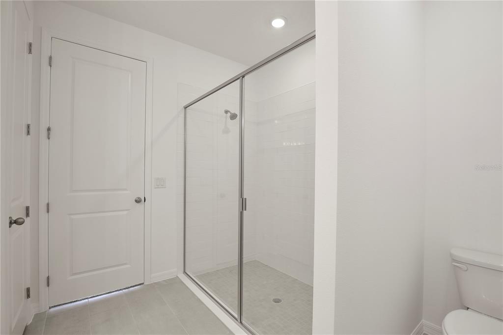 5724 Haystack Drive St. Cloud, FL 34771 - Photo 11 of 23 a bathroom with a shower