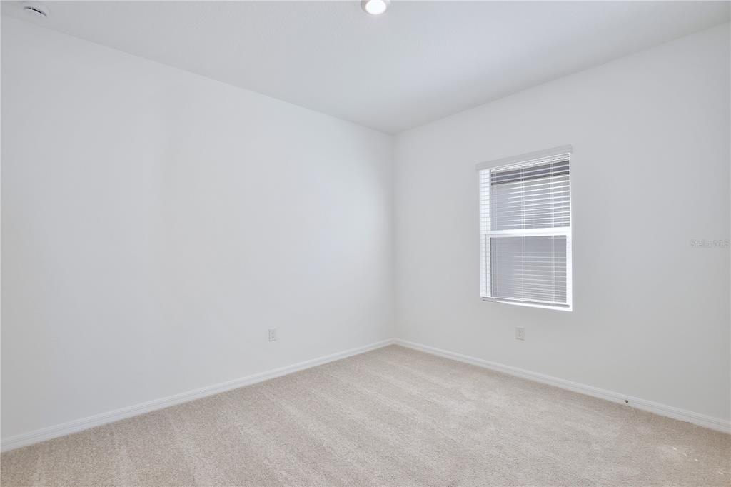 5724 Haystack Drive St. Cloud, FL 34771 - Photo 16 of 23 an empty room with a window