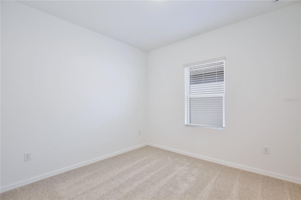 5724 Haystack Drive St. Cloud, FL 34771 - Photo 18 of 23 an empty room with a window