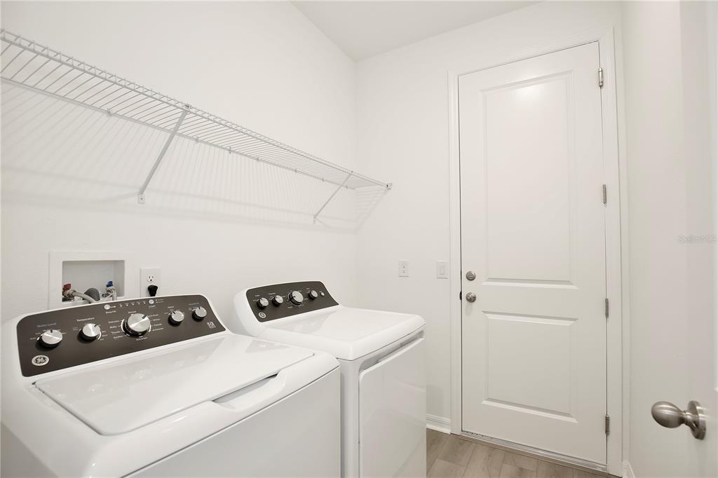 5724 Haystack Drive St. Cloud, FL 34771 - Photo 20 of 23 a utility room with dryer and washer