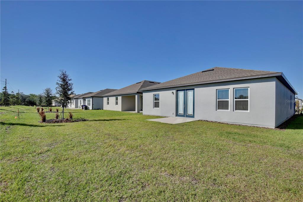 5724 Haystack Drive St. Cloud, FL 34771 - Photo 23 of 23 a front view of a house with a garden