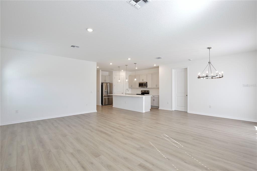 5724 Haystack Drive St. Cloud, FL 34771 - Photo 7 of 23 a view of a kitchen with a sink and wooden floor