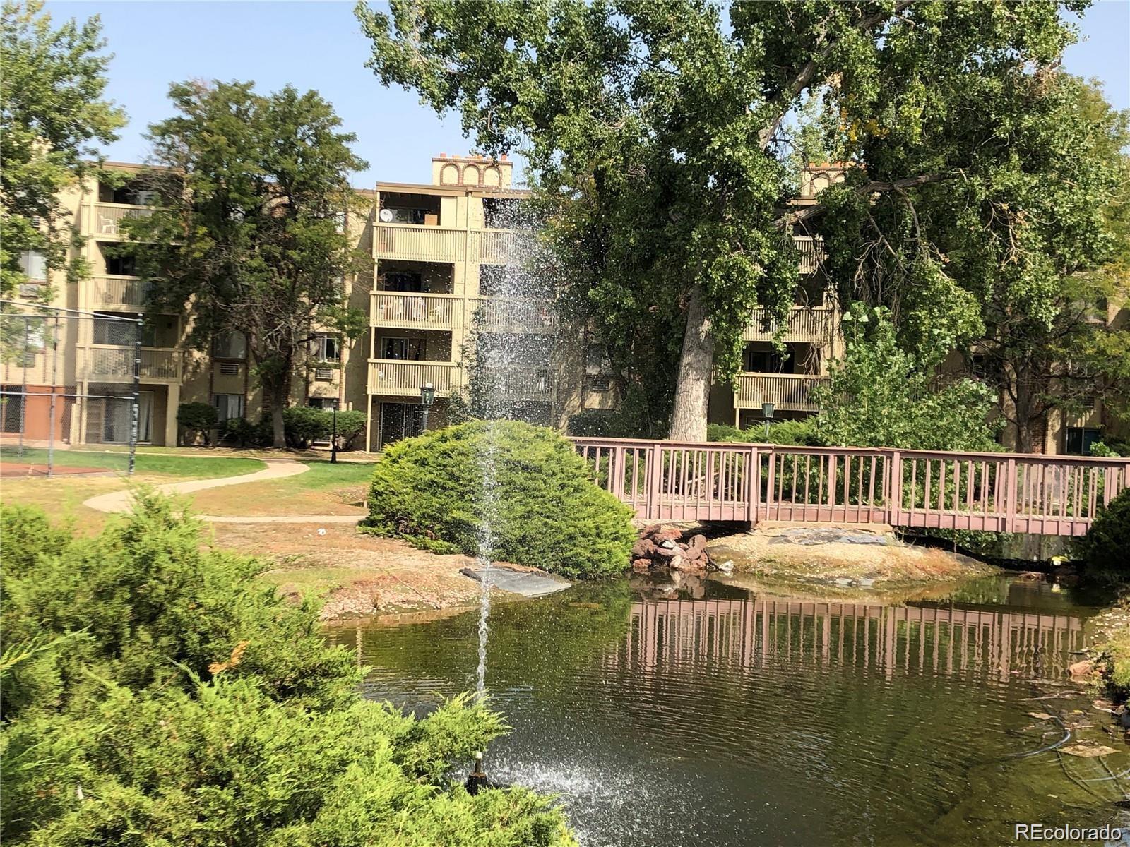 1304 South Parker Road, Unit 240 Denver, CO 80231 - Photo 3 of 19 a balcony with table and chairs