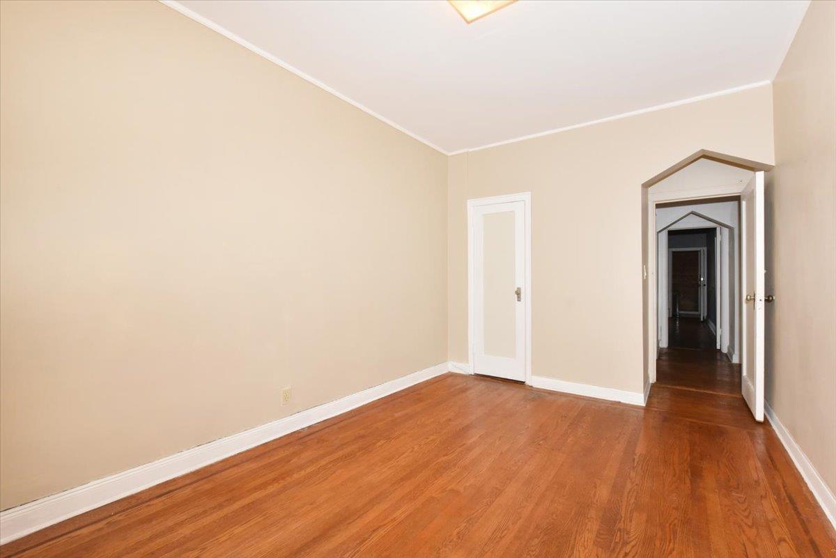 85-76 66th Road Queens, NY 11374 - Photo 10 of 20 Unfurnished room featuring wood finished floors and ornamental molding