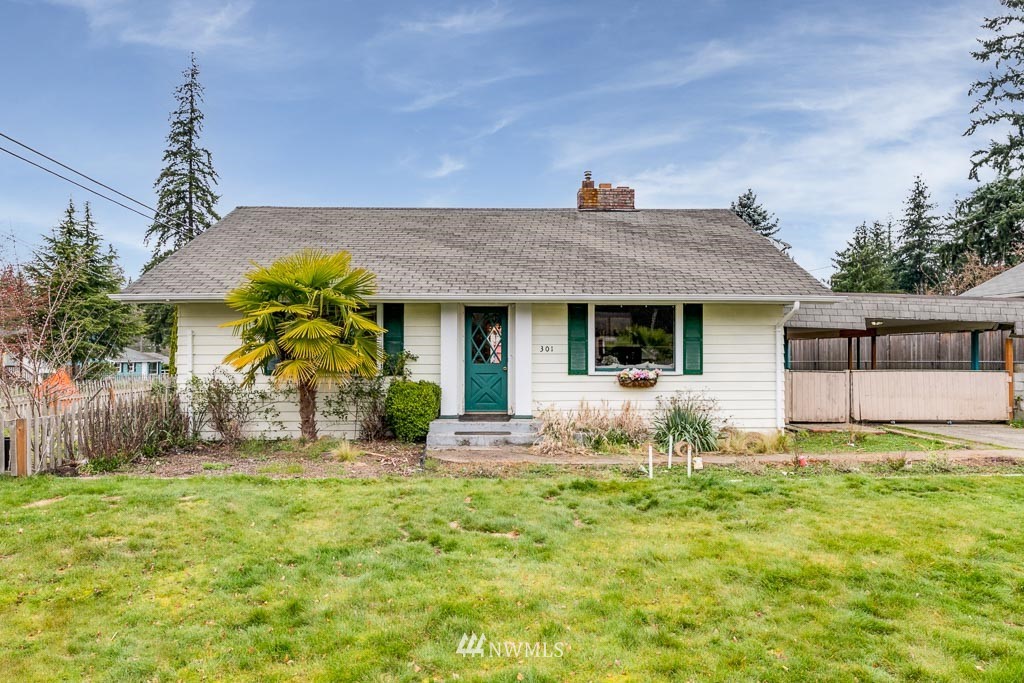 301 North Cabot Road Everett, WA 98203 - Photo 1 of 36 a front view of a house with garden