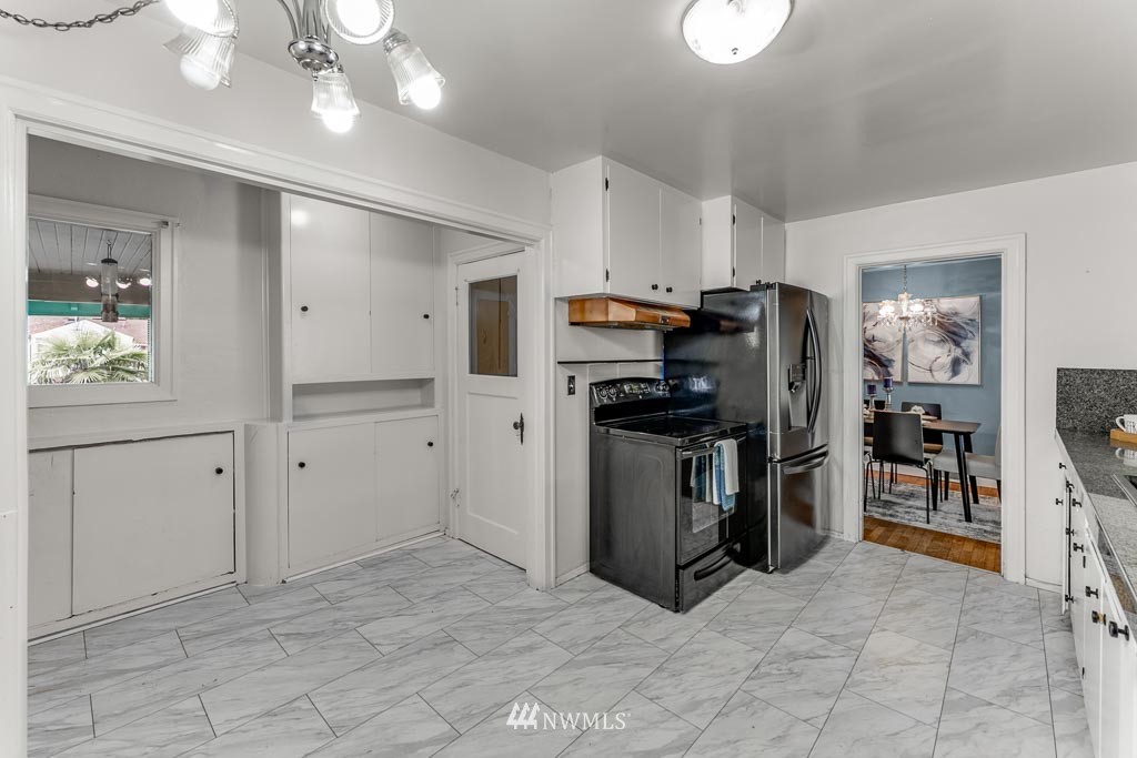 301 North Cabot Road Everett, WA 98203 - Photo 12 of 36 a view of a kitchen with refrigerator and workspace