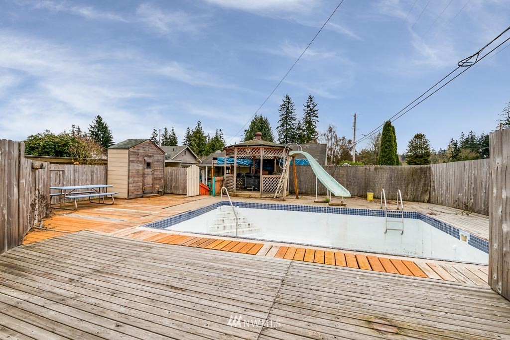 301 North Cabot Road Everett, WA 98203 - Photo 29 of 36 a view of a swimming pool with a lounge chairs
