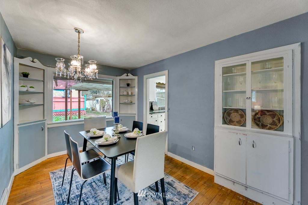 301 North Cabot Road Everett, WA 98203 - Photo 7 of 36 a view of a dining room with furniture and chandelier