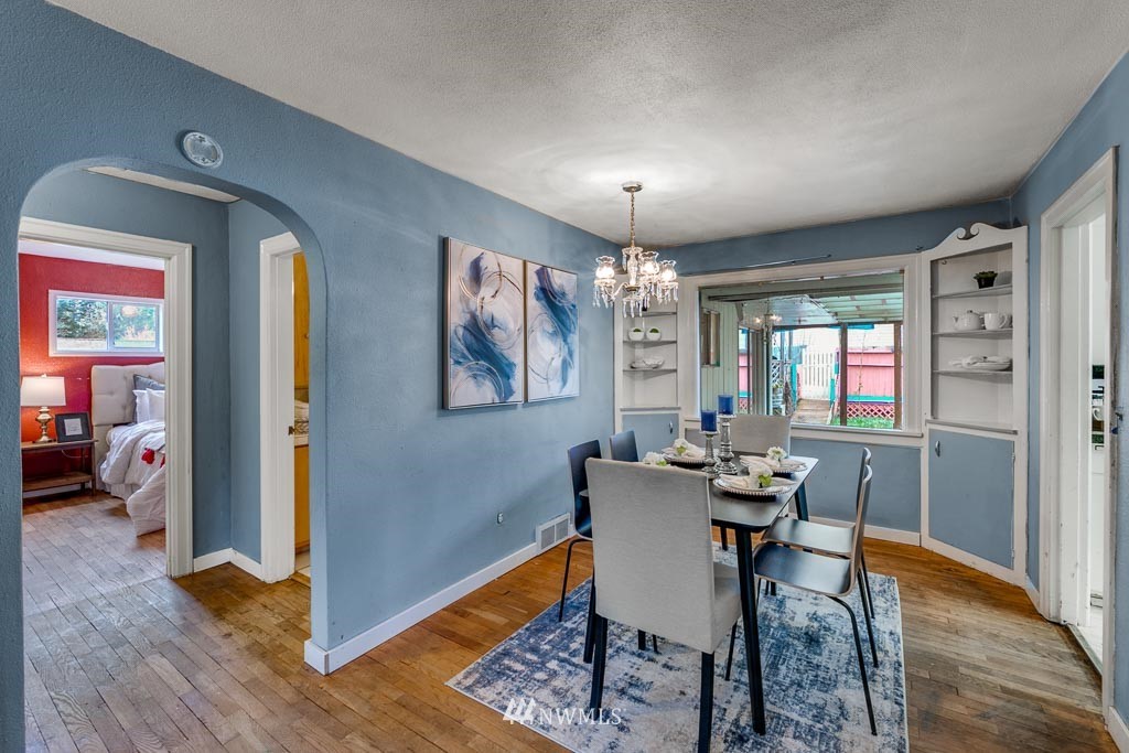 301 North Cabot Road Everett, WA 98203 - Photo 8 of 36 a view of a dining room with furniture window and wooden floor