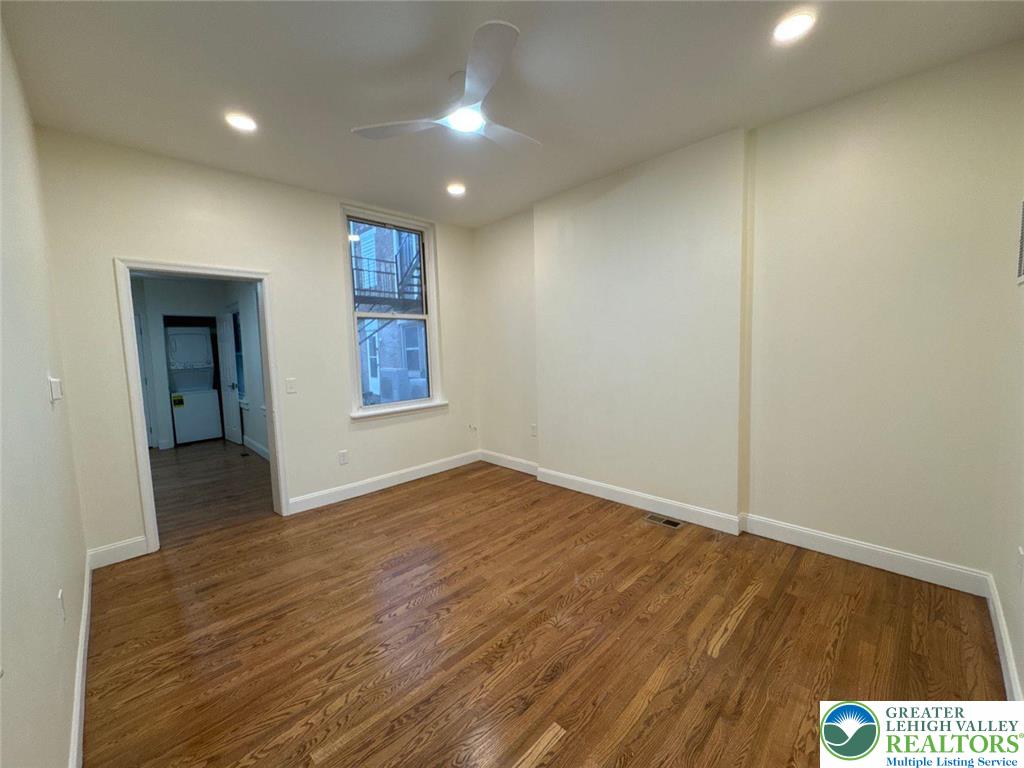 136 Bushkill Street, Unit 1 Easton, PA 18042 - Photo 2 of 11 wooden floor in an empty room with a window