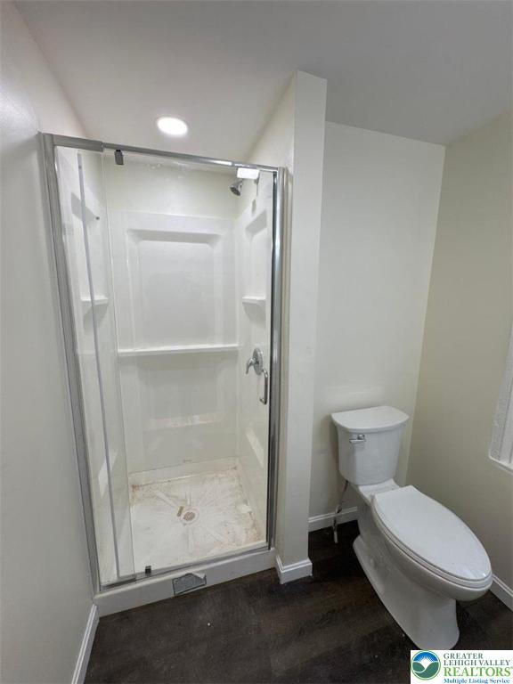 136 Bushkill Street, Unit 1 Easton, PA 18042 - Photo 10 of 11 a white toilet sitting next to a bathroom sink