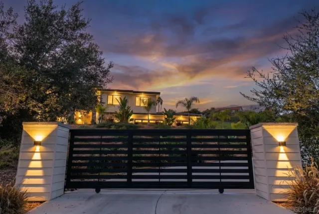 a view of a patio with dining table and chairs with wooden floor