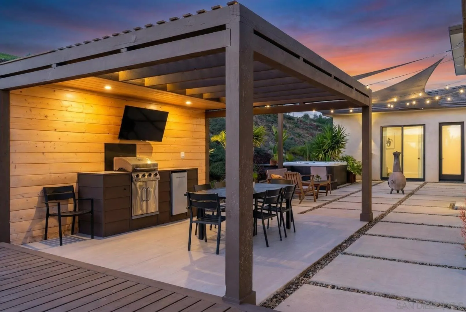 4407 Ramona Drive Fallbrook, CA 92028 - Photo 22 of 27 a view of a patio with dining table and chairs with wooden floor