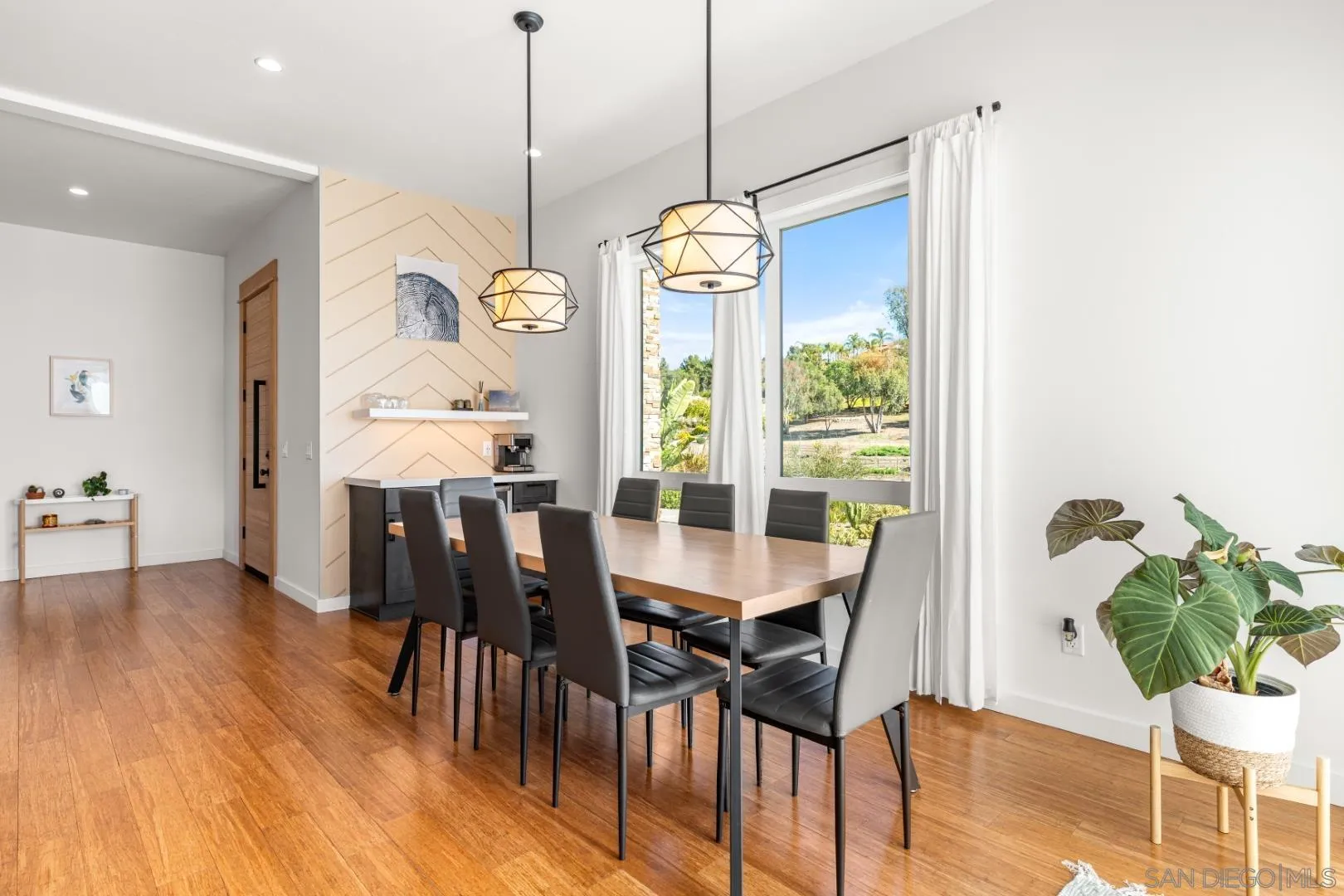 4407 Ramona Drive Fallbrook, CA 92028 - Photo 7 of 27 a dining room with furniture a chandelier and wooden floor