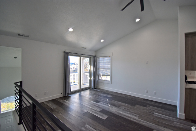 2480 West 450 South, Unit 2 Springville, UT 84663 - Photo 3 of 19 Unfurnished living room featuring dark wood-type flooring, vaulted ceiling, recessed lighting, and a ceiling fan